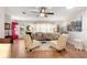 Bright living room featuring stylish decor, natural light, and wood-look flooring at 8874 Sw 95Th St # E, Ocala, FL 34481