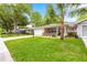 Inviting home with a well-kept lawn, attractive landscaping, and a welcoming front porch at 8874 Sw 95Th St # E, Ocala, FL 34481