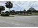 View of a clubhouse with brick accents, lush landscaping, and easy access parking at 8901 Sw 103Rd Ln, Ocala, FL 34481