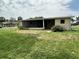 Single story home featuring an enclosed porch, tidy yard, and a neutral color scheme at 8901 Sw 103Rd Ln, Ocala, FL 34481