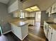 Bright kitchen with white cabinetry, updated flooring, and ample counter space at 8901 Sw 103Rd Ln, Ocala, FL 34481