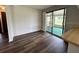 Cozy kitchen flows into the sunroom, featuring hardwood floors and counter seating at 8901 Sw 103Rd Ln, Ocala, FL 34481