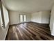 Spacious living room featuring modern flooring and a patio door at 8901 Sw 103Rd Ln, Ocala, FL 34481