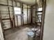 Interior of a shed with shelving, two windows, and exposed wood framework at 8901 Sw 103Rd Ln, Ocala, FL 34481