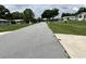 Street view showing homes with manicured lawns in a quiet, suburban neighborhood at 8901 Sw 103Rd Ln, Ocala, FL 34481