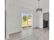Dining area with sliding glass doors leading to the backyard and an elegant modern chandelier at 904 Nw 67Th St, Ocala, FL 34474