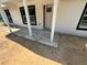 Exterior shot of front porch area with white columns and some construction work needing to be completed at 904 Nw 67Th St, Ocala, FL 34474