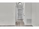 Hallway with modern finishes leading to a bathroom with updated fixtures and stylish design at 904 Nw 67Th St, Ocala, FL 34474