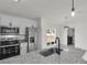 Modern kitchen featuring granite countertops, stainless steel appliances, and abundant natural light at 904 Nw 67Th St, Ocala, FL 34474