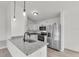 Modern kitchen with stainless steel appliances, granite countertops, and white cabinetry at 904 Nw 67Th St, Ocala, FL 34474