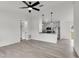 Open-concept space with modern light fixtures, stainless steel appliances and new flooring at 904 Nw 67Th St, Ocala, FL 34474