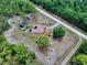 Expansive property showcasing a single-story home, partially wooded acreage and perimeter fencing at 9325 Sw 125Th Court Rd, Dunnellon, FL 34432