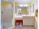 Bright bathroom with a shower, vanity area, and ample storage, promoting functionality at 9325 Sw 125Th Court Rd, Dunnellon, FL 34432