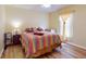 Cozy bedroom with laminate floors and a colorful quilt-covered bed at 9325 Sw 125Th Court Rd, Dunnellon, FL 34432