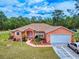 Inviting single-story home with a well-kept lawn and attached two-car garage at 9325 Sw 125Th Court Rd, Dunnellon, FL 34432