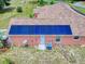 Close-up of solar panels installed on the roof of a home with a back door and air conditioning unit at 9325 Sw 125Th Court Rd, Dunnellon, FL 34432