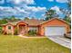 Charming single-story home with a well-manicured front yard and attached two-car garage at 9325 Sw 125Th Court Rd, Dunnellon, FL 34432