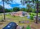 Exterior of a cozy home with solar panels, green space, and a garden at 9325 Sw 125Th Court Rd, Dunnellon, FL 34432