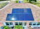 Close up highlighting modern solar panels affixed to the roof, contributing to the property's sustainability at 9325 Sw 125Th Court Rd, Dunnellon, FL 34432