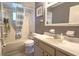 Well-maintained bathroom with a tub-shower, ample counter space, and storage at 9430 Sw 102Nd Pl, Ocala, FL 34481