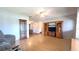 Bright and spacious living room with hardwood floors, a ceiling fan, and a built-in media center at 9430 Sw 102Nd Pl, Ocala, FL 34481