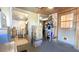 Mud room with access to laundry room and a door to the outside, boxes, and clutter at 9430 Sw 102Nd Pl, Ocala, FL 34481