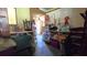 Storage area with items, shelving, and a glimpse of the kitchen and dining areas at 9430 Sw 102Nd Pl, Ocala, FL 34481
