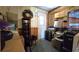 Storage area has items stacked on shelves, a wreath on the wall, and door to the outside at 9430 Sw 102Nd Pl, Ocala, FL 34481