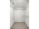 Interior view of a closet with carpet, wire shelving, and ample storage space at 9667 Sw 94Th Ct # C, Ocala, FL 34481