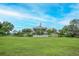Beautiful community center sits atop a hill overlooking a sprawling green lawn with an American flag waving proudly at 9667 Sw 94Th Ct # C, Ocala, FL 34481