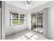 Bright dining area with tile floors, large window, and sliding glass doors to the outdoor living space at 9667 Sw 94Th Ct # C, Ocala, FL 34481