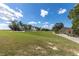 Scenic view of the golf course with lush green fairways, mature trees, and a blue sky at 9667 Sw 94Th Ct # C, Ocala, FL 34481