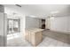 Open concept kitchen with an island and view to an adjacent room at 9667 Sw 94Th Ct # C, Ocala, FL 34481