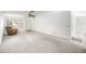 Open concept living room with neutral carpet, ceiling fan, and natural light at 9667 Sw 94Th Ct # C, Ocala, FL 34481