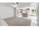 A view of the open concept living and dining area with tile and carpet flooring at 9667 Sw 94Th Ct # C, Ocala, FL 34481