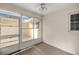 View of the screened in porch, featuring neutral paint and ceiling fan at 9667 Sw 94Th Ct # C, Ocala, FL 34481