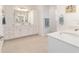 Elegant bathroom with double sinks, white cabinets, and quartz countertops at 9839 Sw 90Th St, Ocala, FL 34481