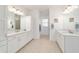 Spacious bathroom with double sinks, white cabinetry, and ample counter space at 9839 Sw 90Th St, Ocala, FL 34481