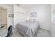 Bright bedroom featuring a cozy bed, and a functional workspace and closet at 9839 Sw 90Th St, Ocala, FL 34481