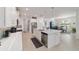 Open kitchen design with island, stainless appliances, and breakfast nook for casual dining at 9839 Sw 90Th St, Ocala, FL 34481