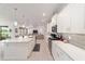 Bright kitchen features a large island with pendant lighting and stainless steel appliances at 9839 Sw 90Th St, Ocala, FL 34481
