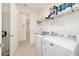 Functional laundry room with washer and dryer and sink at 9839 Sw 90Th St, Ocala, FL 34481
