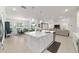 Bright, open floorplan with kitchen island, dining area, and living space, great for entertaining at 9839 Sw 90Th St, Ocala, FL 34481