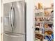 Stainless steel refrigerator and pantry with organized shelving at 9839 Sw 90Th St, Ocala, FL 34481
