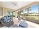 Relaxing screened patio with comfortable furniture and picturesque views of the surrounding greenery at 9839 Sw 90Th St, Ocala, FL 34481