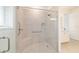 Tiled walk-in shower with glass door and built-in bench at 9839 Sw 90Th St, Ocala, FL 34481