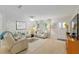 Cozy and inviting living room with neutral tones, stylish decor, and ample seating for entertaining at 9940 Sw 101St Pl, Ocala, FL 34481