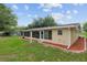 The rear exterior shows a Florida room and simple landscaping at 9940 Sw 101St Pl, Ocala, FL 34481