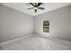 A cozy bedroom with a window and marble floors at 14540 Se 33Rd Ter, Summerfield, FL 34491