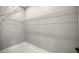 Walk-in closet featuring custom shelving and marble flooring at 14540 Se 33Rd Ter, Summerfield, FL 34491